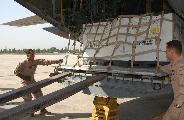 Puerto Rico Air National Guardsmen Master Sgt. J.P. Ortiz and Senior Master Sgt. Carlos Sepulveda unload supplies from their C-130 Hercules at Chaklala Air Force Base, Islamabad, Pakistan. Since October 3, Air Force C-130 Hercules aircraft, assigned to the 455th Air Expeditionary Wing, Bagram Airfield, Afghanistan, and a trio of Army CH-47 Chinook helicopters began delivering rebuilding materials to the people who live in the north eastern part of the country, which was ravaged by a 7.6 earthquake last year. The C-130 is from the Puerto Rico Air National Guard's 156th Airlift Wing. (U.S. Air Force photo/Senior Airman J.G. Buzanowski)