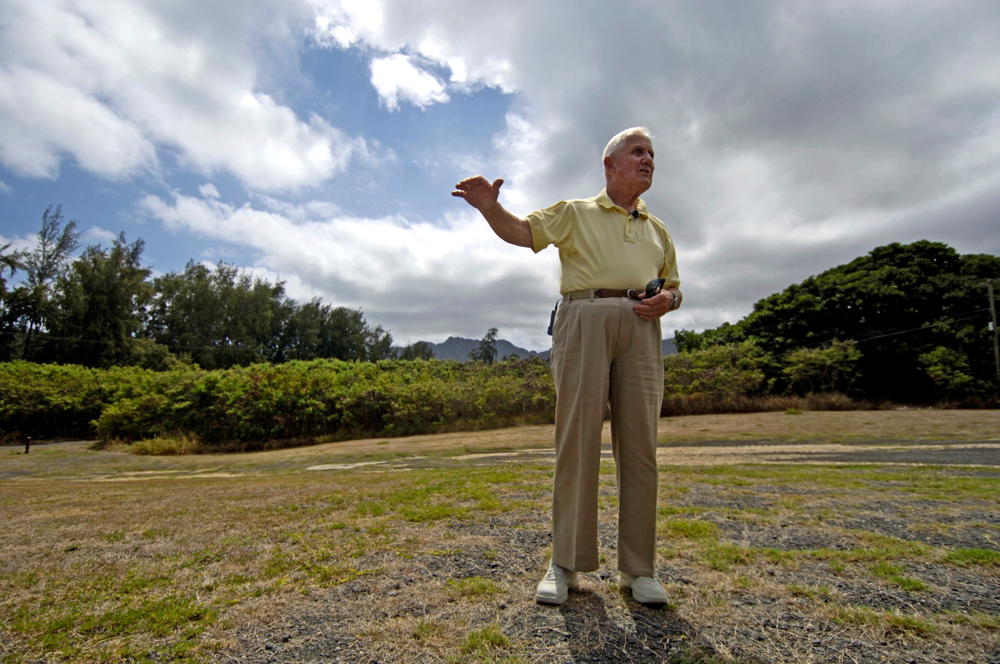 Raymond Stehle explains where the headquarters building and tent city were located in 1941 at Bellows Air Force Station, Hawaii, during a visit Sept. 30.  Mr. Stehle was stationed at Bellows Army Air Field when the Japanese attacked on Dec. 7, 1941. (U.S. Air Force photo/Tech. Sgt. Shane A. Cuomo) 