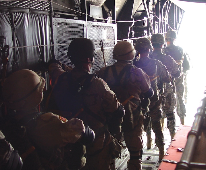 U.S. Army Special Operations Forces and host nation paratroopers board an MC-130E Combat Talon I aircraft in preparation for a static line personnel airdrop in Jordan. Wing personnel worked closely with multinational counterparts during Air Force Special Operations Tasking for Early Victor 2006 (U.S. Air Force photo/Staff Sgt. Michael Tijerina)                               