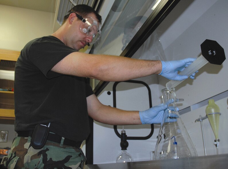 Staff Sgt. Charles Harris, 919th Logistics Readiness Squadron quality control inspector, checks fuel for impurities at the fuels laboratory here Sept. 27. The laboratory is part of the new petroleum-oil-lubricant complex that was built to reduce safety hazards and improve fuel capability and testing. (U.S. Air Force photo/Jasmine DeNamur)