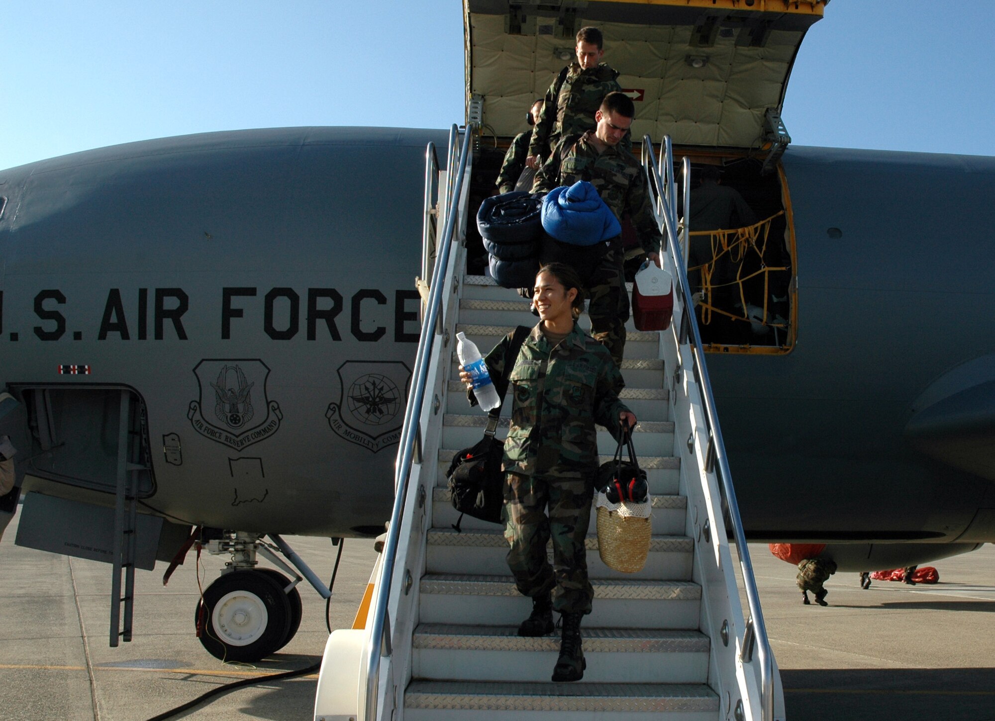 Air Force Reservists from the 940th Air Refueling Wing at Beale Air Force Base, Calif. depart a KC-135R Stratotanker Oct. 6, 2006 after deployment to Andersen AFB, Guam.  Nearly 100 Citizen Airmen and multiple jets were deployed from the 940th for a month supporting the Global War on Terror. (U.S. Air Force photo/Stacey Knott)