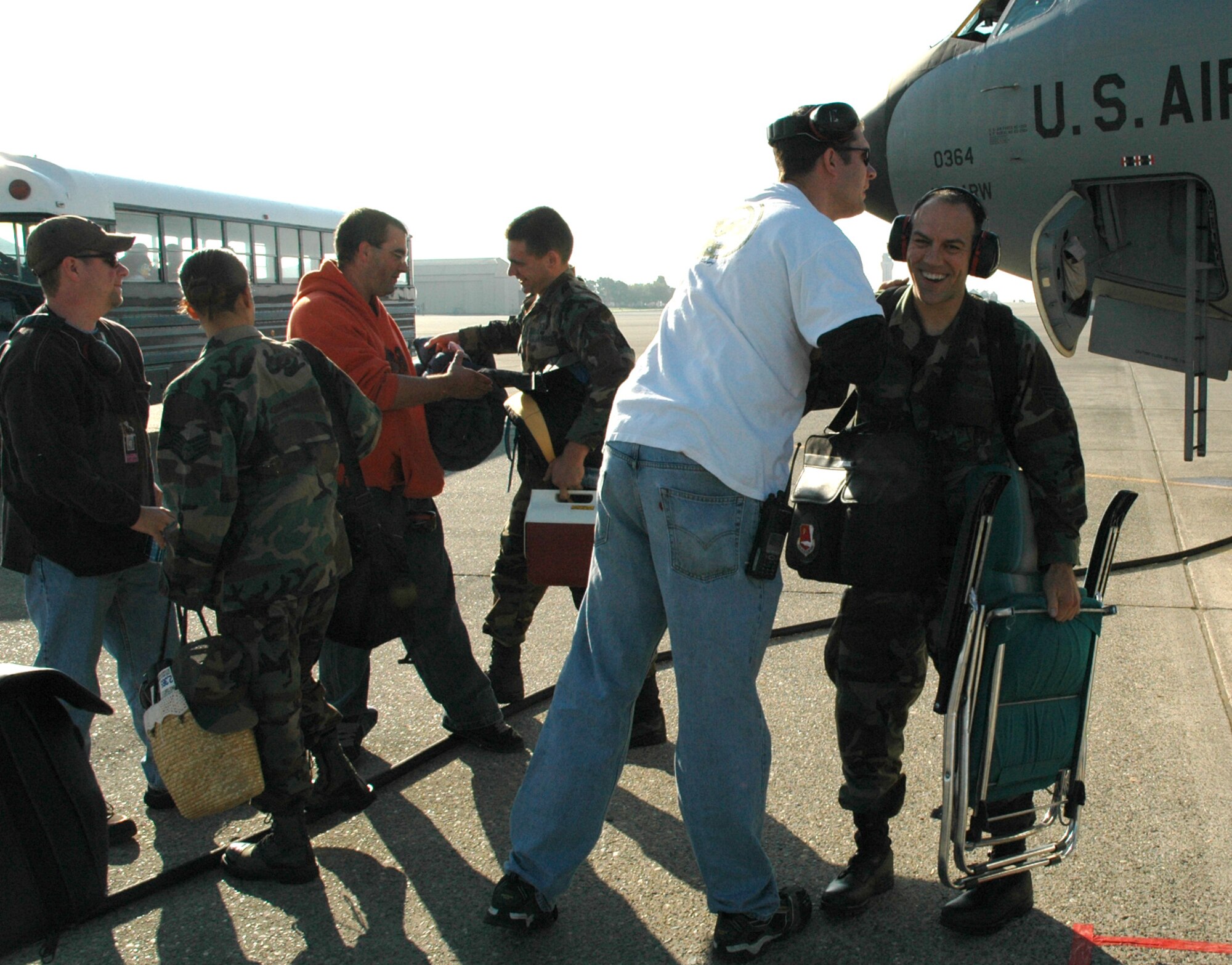 Air Force Reservists from the 940th Air Refueling Wing at Beale Air Force Base, Calif. are welcomed home Oct. 6, 2006 by co-workers after being deployed to Anderson AFB, Guam.  Nearly 100 Citizen Airmen and multiple KC-135 Stratotankers were deployed from the 940th for a month flying air-to-air refueling missions supporting the Global War on Terror. (U.S. Air Force photo/Stacey Knott)