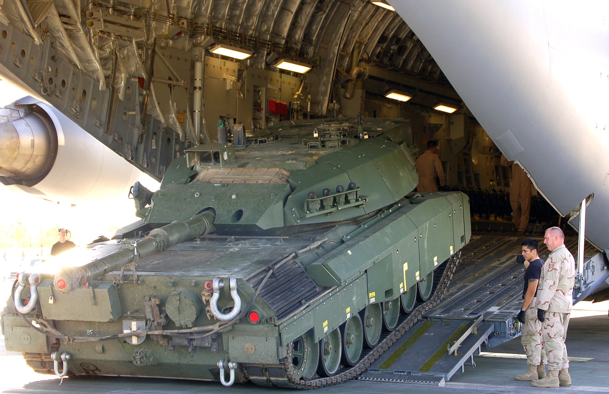 A Canadian Leopard tank is driven onto the C-17 Globemaster III named the "Spirit of McChord" for transport Oct. 7 from Manas Air Base, Kyrgyzstan, to Kandahar Air Base, Afghanistan. The "Spirit of McChord" and its crew made two trips in one day shuttling Canadian armor and heavy equipment into theatre. The crews and C-17s are deployed from the 10th Airlift Squadron at McChord Air Force Base, Wash. (U.S. Air Force photo/Master Sgt. Mitch Gettle)