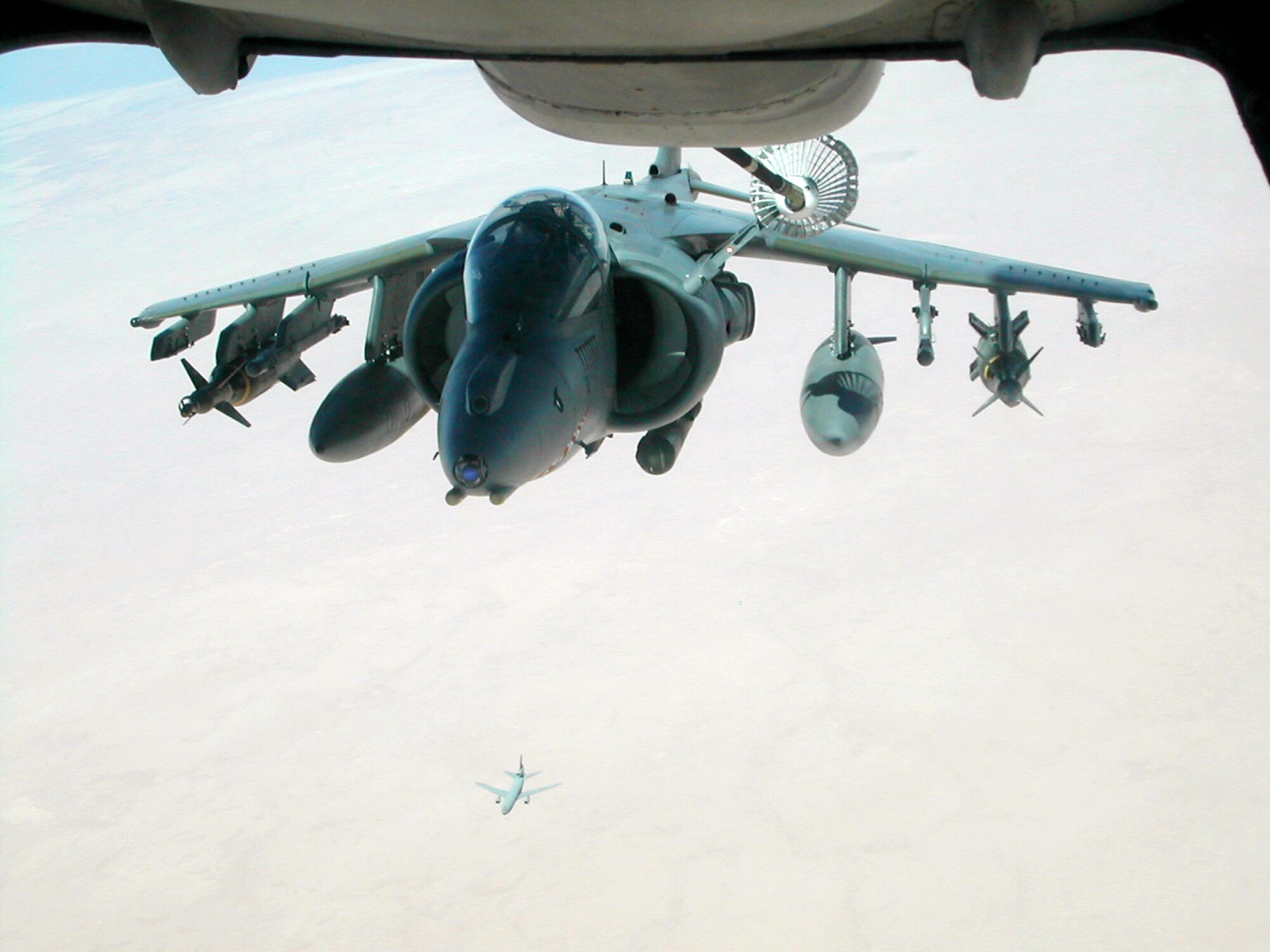 A KC-10 Extender assigned to the 380th Air Expeditionary Wing refuels an AV-8 Harrier recently while another KC-10 flies below it. The 380th AEW is the largest air refueling unit in the Middle East and comprises KC-10s and KC-135 Stratotankers. (U.S. Air Force photo) 