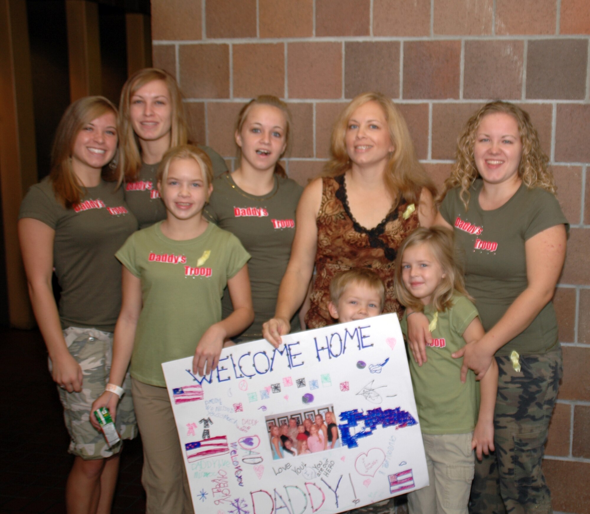 The family of Chief Master Sgt. Robert Shanks, 315th Civil Engineer Squadron, Charleston AFB, S.C., wait the return of their father from a four-month deployment to Southwest Asia. (Photo by Master Sgt. Thomas Crawford USAFR)