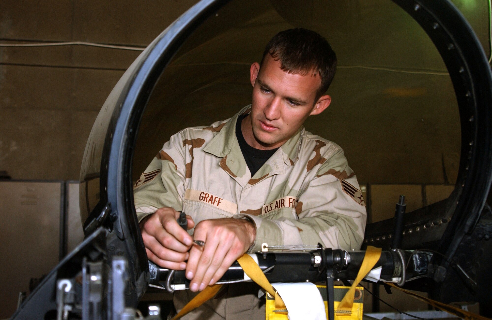 Senior Airman Steven Graff conducts a canopy inspection on an F-16 Fighting Falcon Oct. 10 at Balad Air Base, Iraq. Airman Graff is an aircrews egress systems journeyman assigned to the 332nd Expeditionary Aircraft Maintenance Squadron. (U.S. Air Force photo/Staff Sgt. Alice Moore) 
