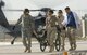 Army Staff Sgt. Tanisha Denton, Staff Sgt. Stacy McGill and Senior Airman Armando Pena assist Senior Airman Brett Batson in transporting a wounded Soldier from a helicopter into the Balad Air Base, Iraq, hospital emergency room Oct. 1.  The medical personnel are deployed from the 25th Infantry Division at Schofield Barracks, Hawaii; the 59th Medical Wing at Lackland Air Force Base, Texas; and the 99th Medical Group at Nellis AFB, Nev. (U.S. Air Force photo/Master Sgt. Scott Wagers)