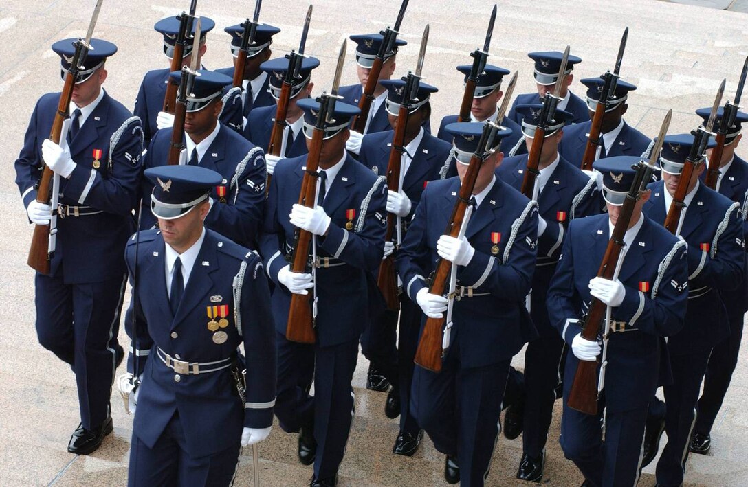 Ceremonial guardsmen march up the steps of the Tomb of the Unknown Soldier during a Joint Service Wreath Laying ceremony. (U.S. Air Force photo/USAF Honor Guard Public Affairs)