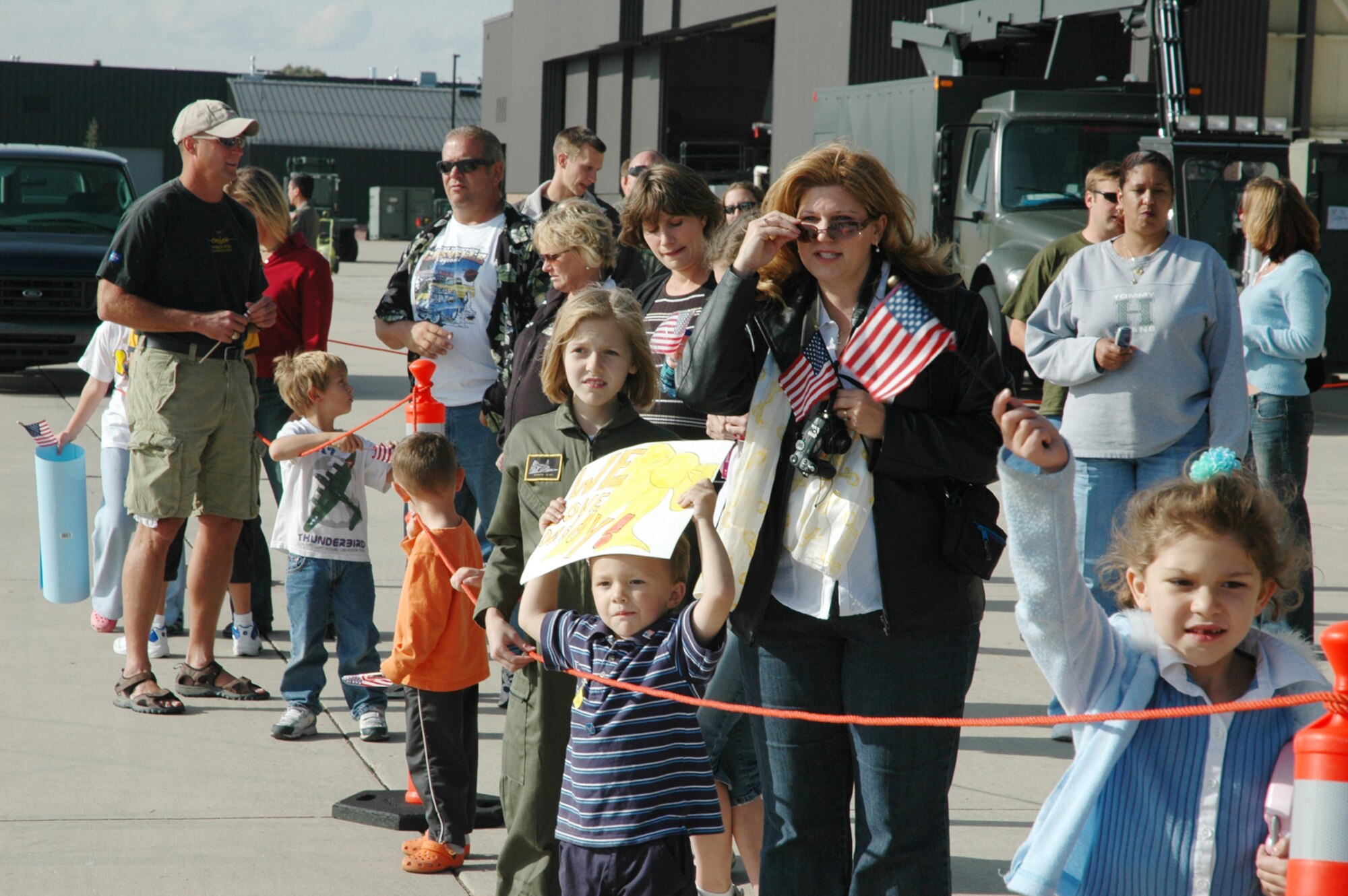 302nd Airlift Wing family members look for their loved ones during the recent 302nd Airlift Wing homecomings. The wing had been activated since August 2005 to support U.S. Central Command operations in Southwest Asia. The last group of 302nd Reservists returned home Oct. 4. (U.S. Air Force photo by Staff Sgt. Derrick M. Gildner)