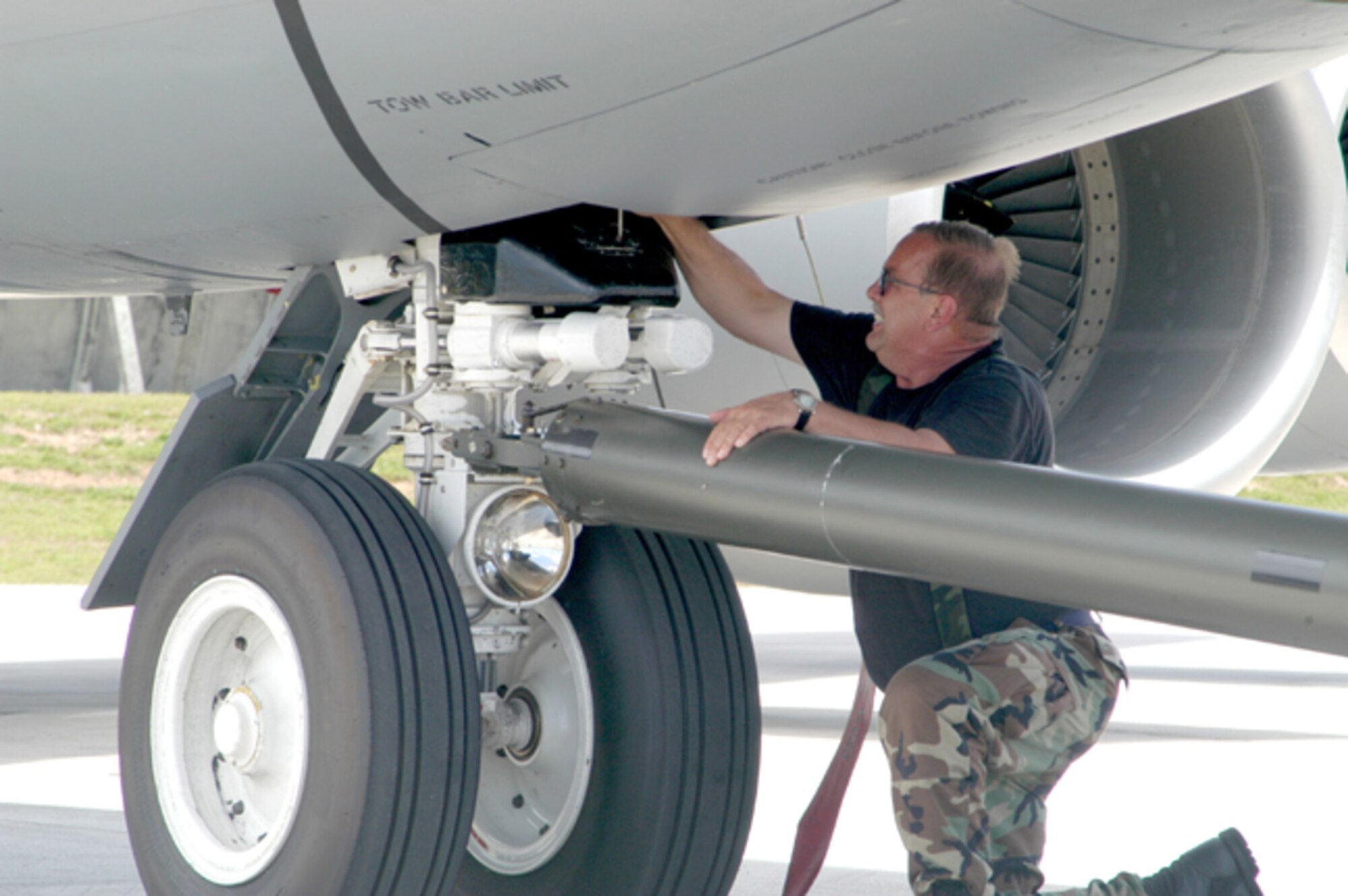 GRISSOM AIR RESERVE BASE, IND -- Master Sgt. John Keller, a KC-135R crew chief, prepares one of Grissom's Stratotankers for towing at Andersen AFB, Guam. The 434th Air Refeuling Wing deployed to the island in support of refueling operations in the Pacific. (U.S. Air Force photo/SrA. Roberto Modelo)