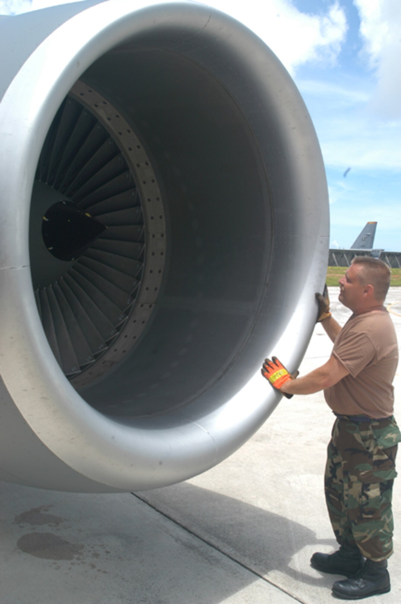 GRISSOM AIR RESERVE BASE, Ind -- Staff Sgt. Kevin Kaufmann, a jet engine mechanic with the 434th Aircraft Maintenance Squadron, looks at the baffle duck lining in the intake area of a KC-135R Stratotanker engine. Sergeant Kaufmann and other members of the 434th Air Refueling Wing deployed to Andersen AFB, Guam, and provided aerial refueling support to B-52 Bombers and other aircraft in the Pacific region. (U.S. Air Force photo/SrA. Roberto Modelo)