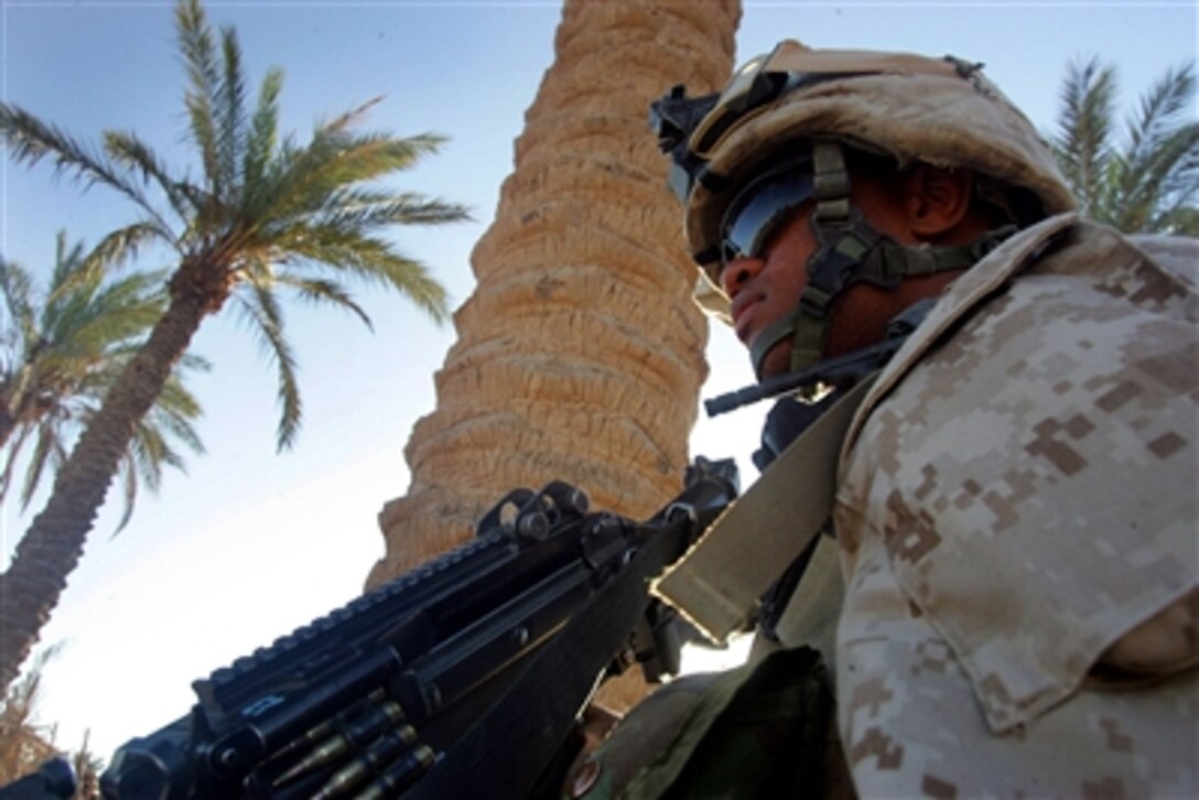 U.S. Marine Corps Lance Cpl. Clfford Sajous, a rifleman with 3rd Battalion, 2nd Marine Regiment under Regiment Combat Team 5 patrols the streets in the Habbaniyah neighborhod of Iraq, Sept. 28, 2006.  