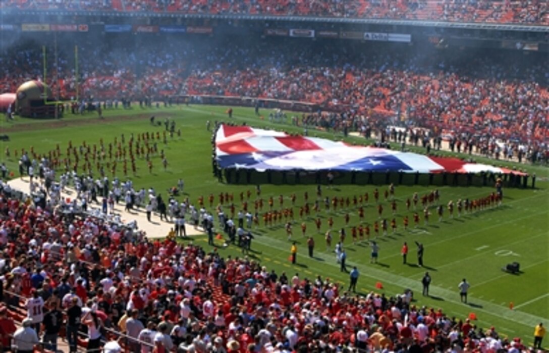 U.S. Navy sailors in San Francisco for Fleet Week 2006 participate in opening ceremonies for the National Football League game between the San Francisco 49ers and the Oakland Raiders at Monster Park, Oct. 8, 2006.  Fleet Week is a joint celebration of the sea services by the City by the Bay and the U.S. Navy.  