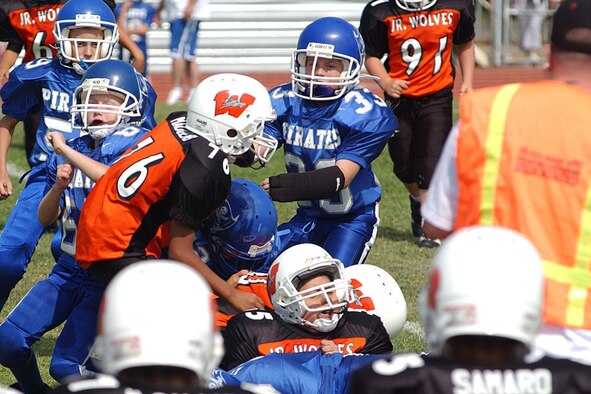 Riley Arnold, No. 33, tackles an opponent during a Junior Pee Wee football game at the Wheatland High School football field. Riley is a fourth grader from Lone Tree Elementary School and is the only girl on the Pirates Junior Pee Wee football team. (Courtesy photo)
