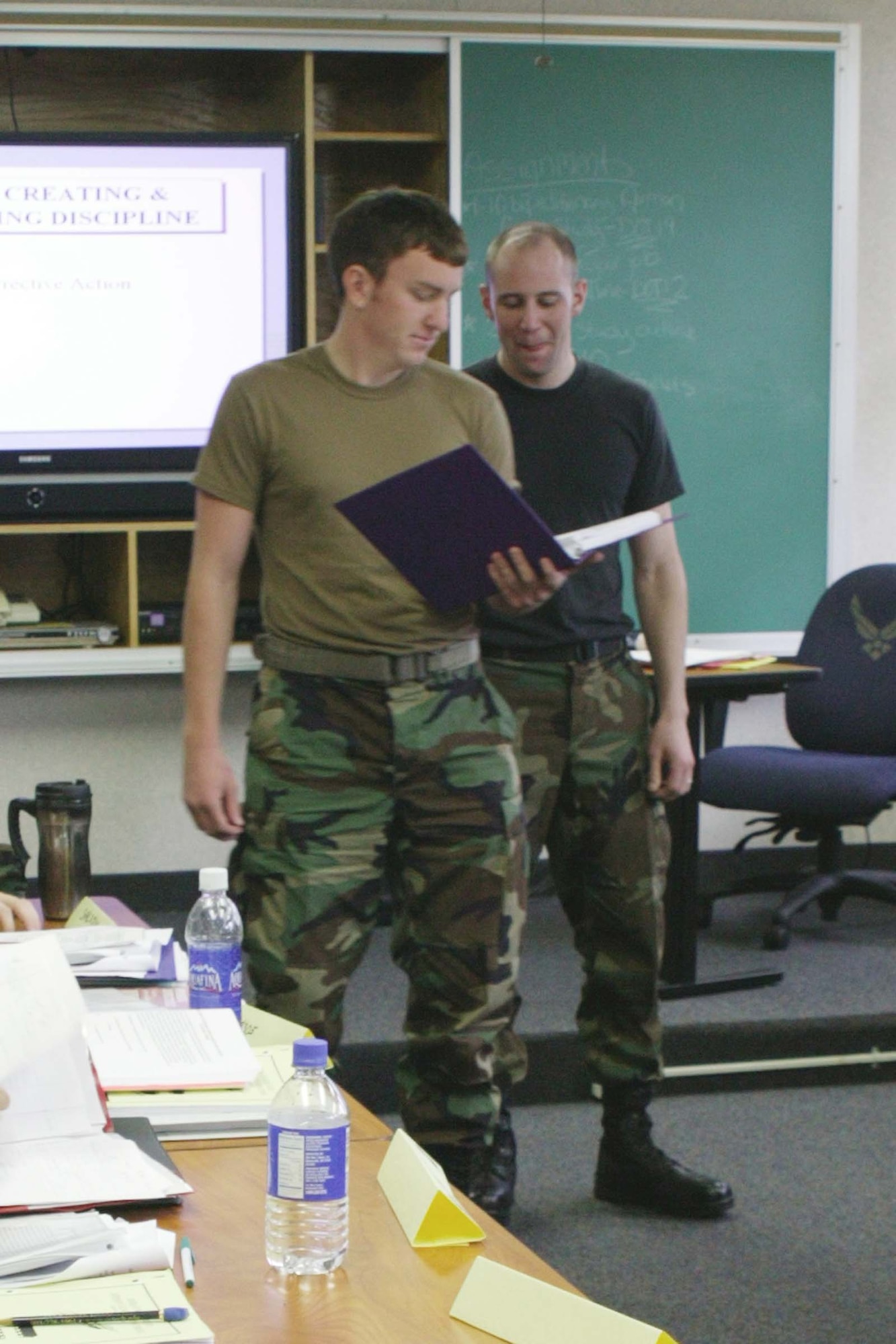 Senior Airmen Justin Amy and Vincent Townsend, ALS students, practice public speaking during a break. (U.S. Air Force photo/Senior Airman Holly MacDonald)