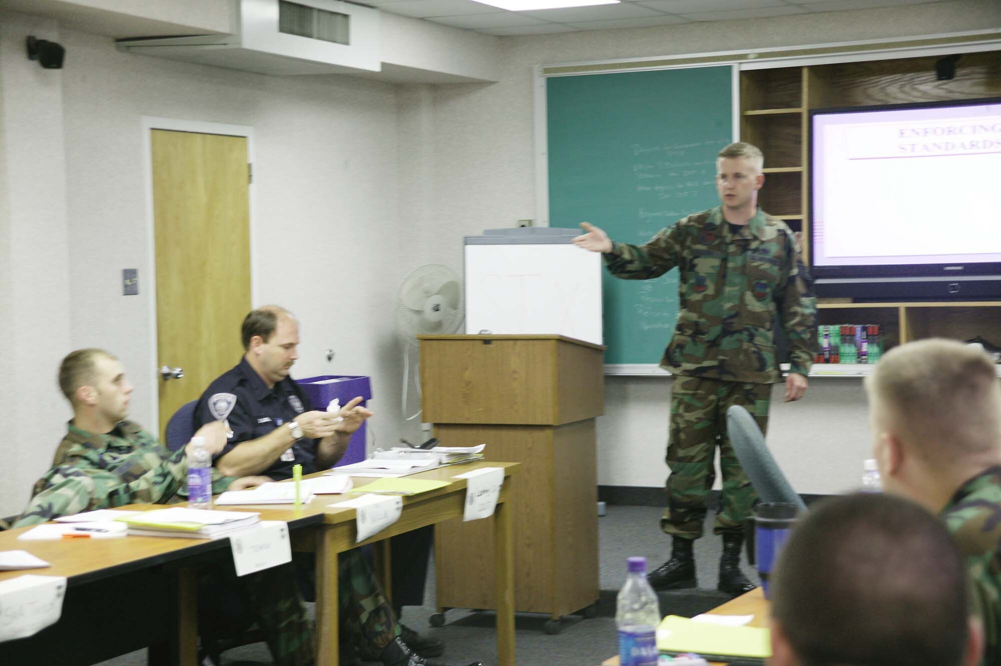 Staff Sgt. Scott Frazier teaches enforcing Air Force standards during leadership academics. (U.S. Air Force photo/Senior Airman Holly MacDonald)
