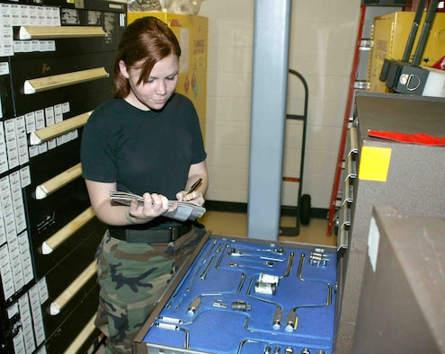 Airman 1st Class Erin Pangborn, 79th Aircraft Maintenance Unit crew chief, performs accountability and inspects tools and equipment in the support section. (U.S. Air Force photo/Senior Airman John Gordinier)