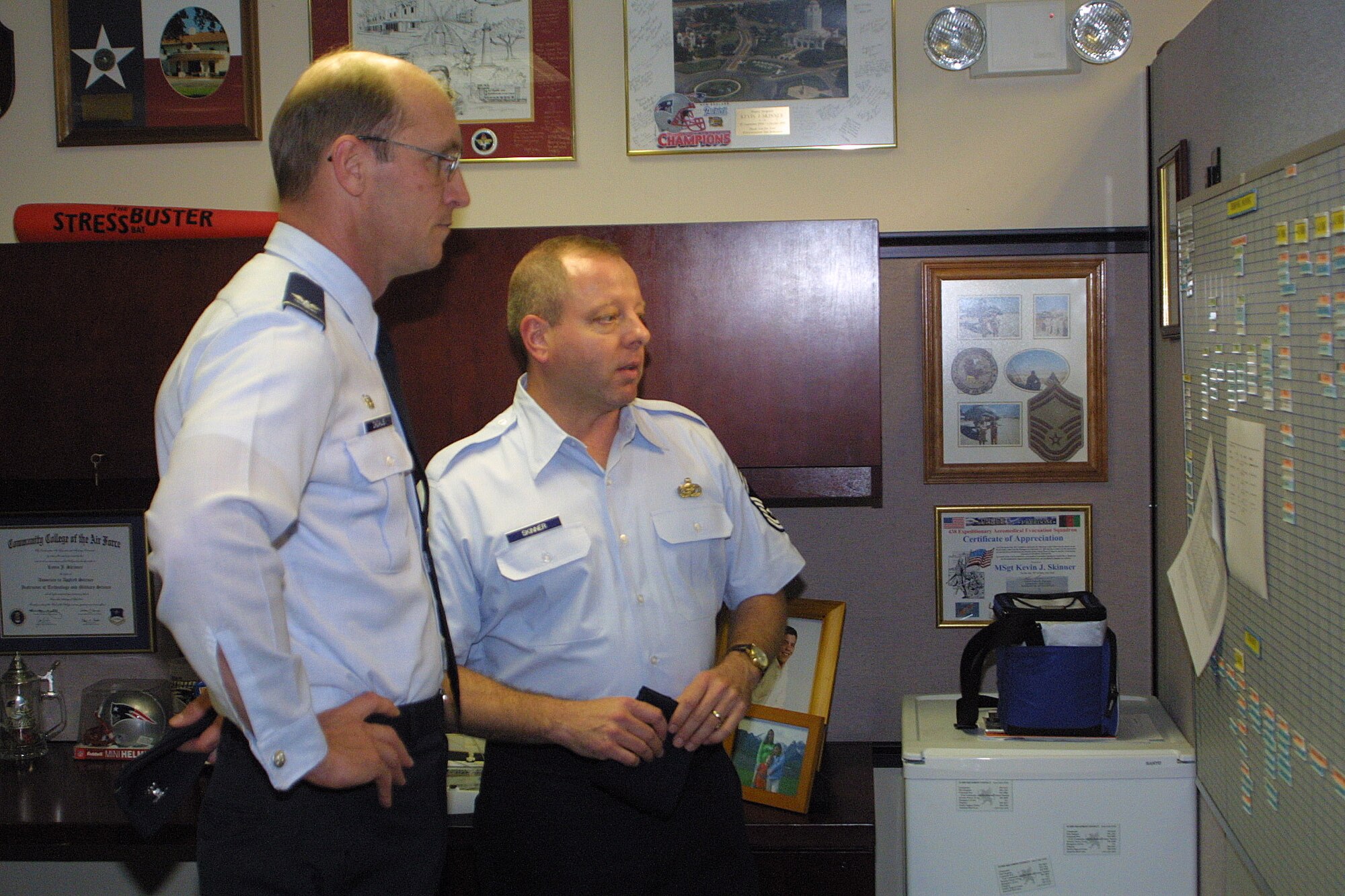 Col. Timothy Zadalis, 43rd Airlift Wing commander, visits military personnel flight and reviews the manpower authorizations for MPF with Chief Master Sgt. Kevin Skinner, 43rd Mission Support Squadron MPF superintendent, during a leadership walk-through of the premises Tuesday. (U.S. Air Force photo/Ed Drohan)