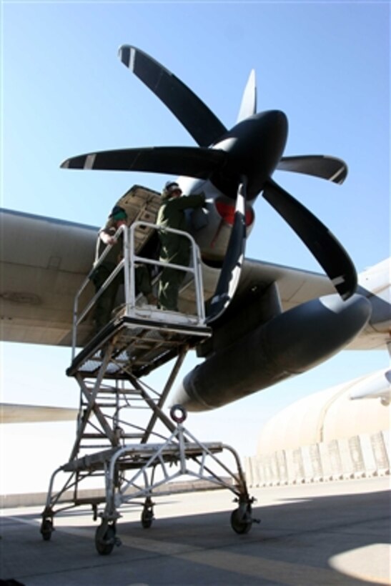 U.S. Marines replace a vibration sensor in a KC-130 Hercules aircraft at Al Asad Air Base, Iraq, on Oct. 6, 2006.  The Marines are assigned to the Marine Aerial Refueler Transport Squadron 352.  
