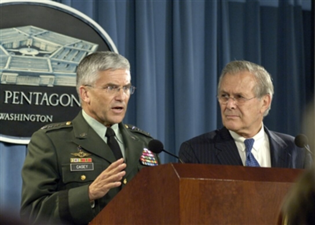 Commander of the Multinational Force in Iraq Gen. George Casey (left), U.S. Army, and Secretary of Defense Donald H. Rumsfeld (right) conduct a Pentagon press briefing on Oct. 11, 2006.  