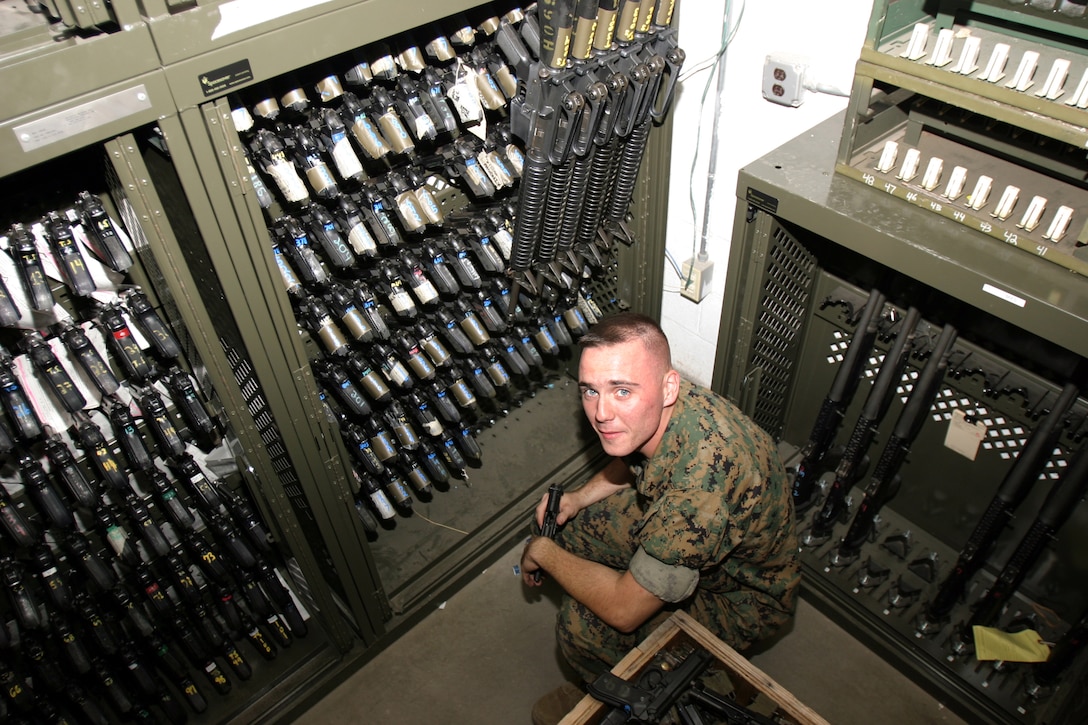 MARINE CORPS BASE CAMP LEJEUNE, N.C.?Lance Cpl. Michael Perry, small arms repair technician for II Marine Expeditionary Force Headquarters Group, II MEF, conducts a sight count of the weapons in his armory, Oct. 12.  Perry is charged with the accountability of more than 4,000 weapons.