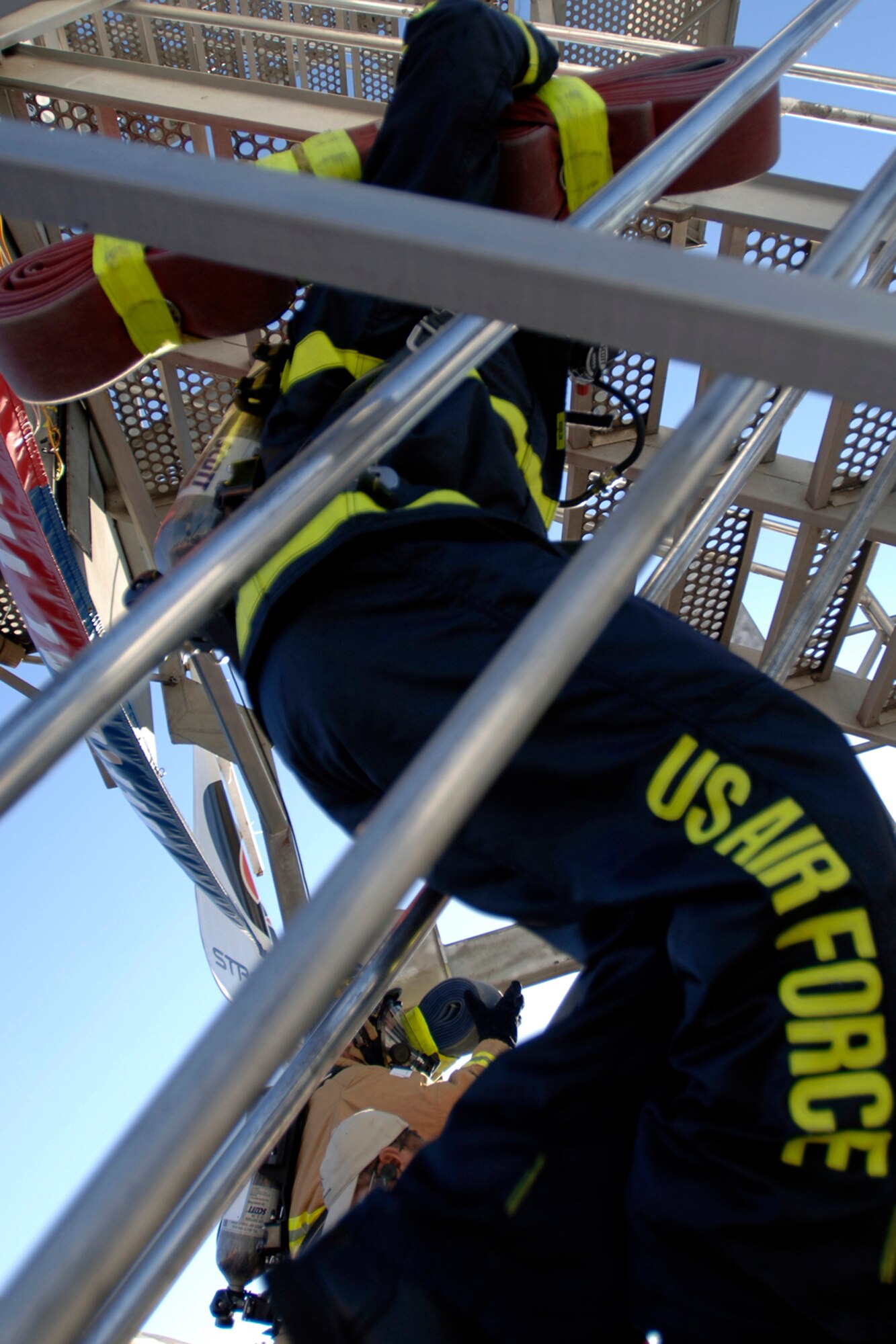 Dave Chiodo, Team Travis, runs up five flights of stairs with a wrapped up fire hose during the Firefighter Combat Competition at Morrow, Ga., Oct. 13, 2006.  (U.S. Air Force photo/Tech. Sgt. Cecilio M. Ricardo Jr.)