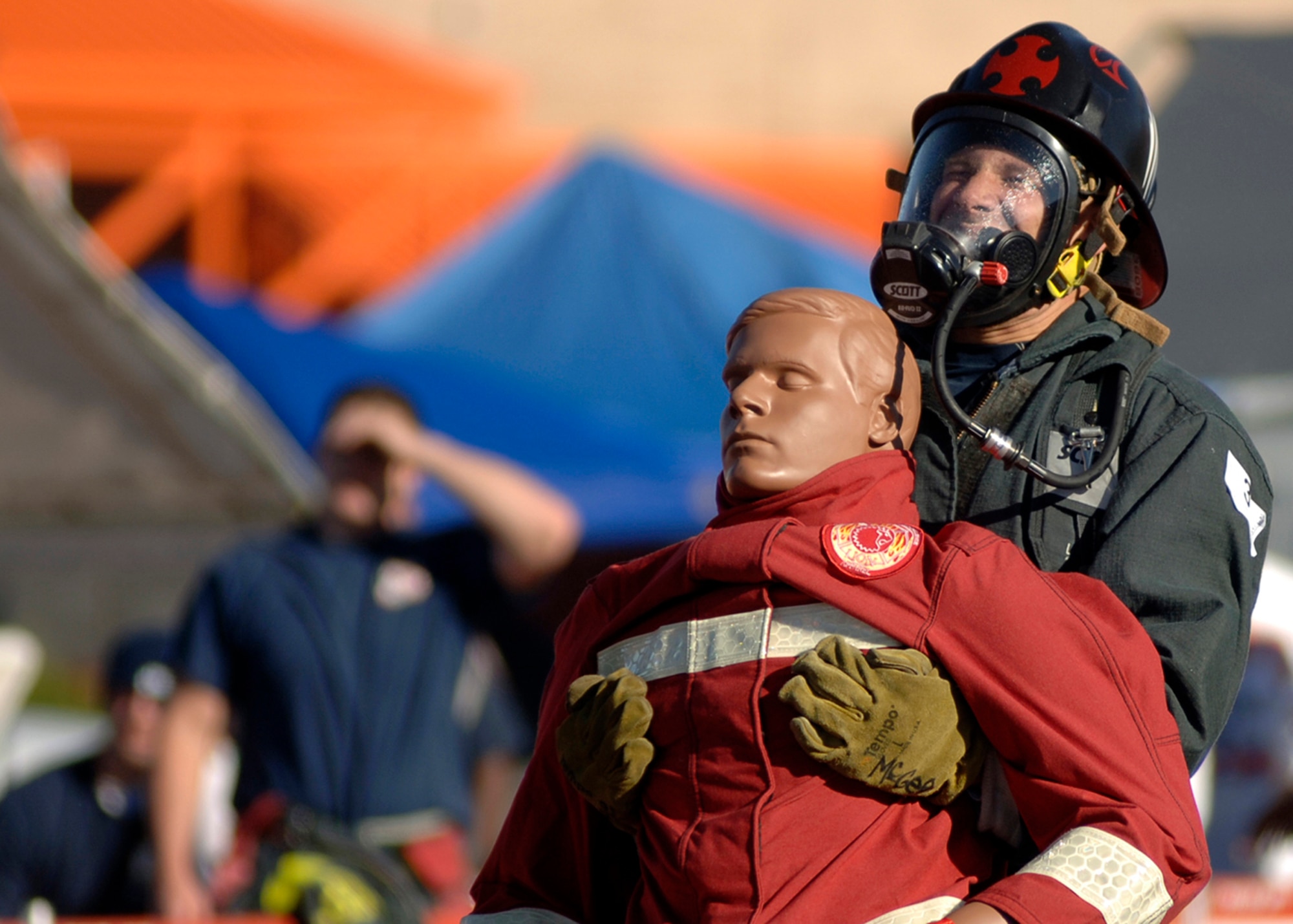 Cory McGee, Whiteman Air Force Base, Mo., carries a 170-pound dummy to finish the last part of the Firefighter Combat Competition obstacle course at Morrow, Ga., Oct. 13, 2006.  (U.S. Air Force photo/Tech. Sgt. Cecilio M. Ricardo Jr.)