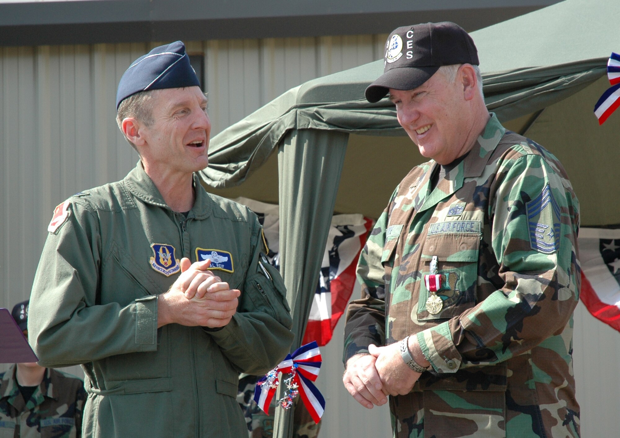 Col. Al Reif, 940th Air Refueling Wing commander, shares a moment with Air Force Reservist Chief Master Sergeant Donald Pope, 940th Civil Engineer Squadron Force Management Superintendent, during his retirement ceremony Sept. 9, 2006 at Beale Air Force Base, Calif.  The chief joined the Air Force when he was just 17 years old because "it sounded good," and retired with 41 years of military service.  Chief Pope advises Airmen to do their best.  "Listen to your supervisors and find out their expectations and meet them.  Then you'll do great!" (U.S. Air Force photo/Stacey Knott)