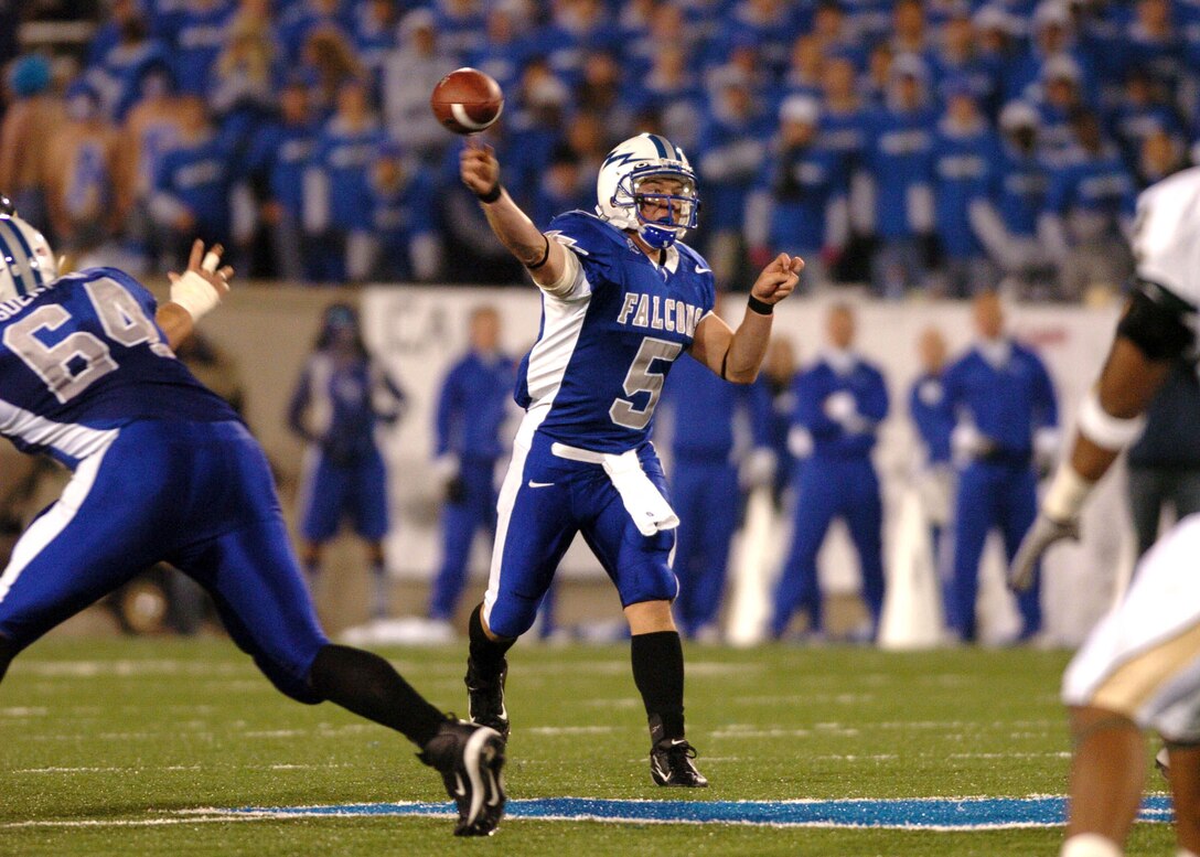 Air Force quarterback Shaun Carney throws downfield for a 13 yard gain and a Falcon first down Thursday night against cross-state rival Colorado State. With 109 yards rushing and 102 passing, Carnedy led Air Force to a 24-21 win after trailing at halftime 21-3. (U.S. Air Force photo/1st Lt. John Ross)

