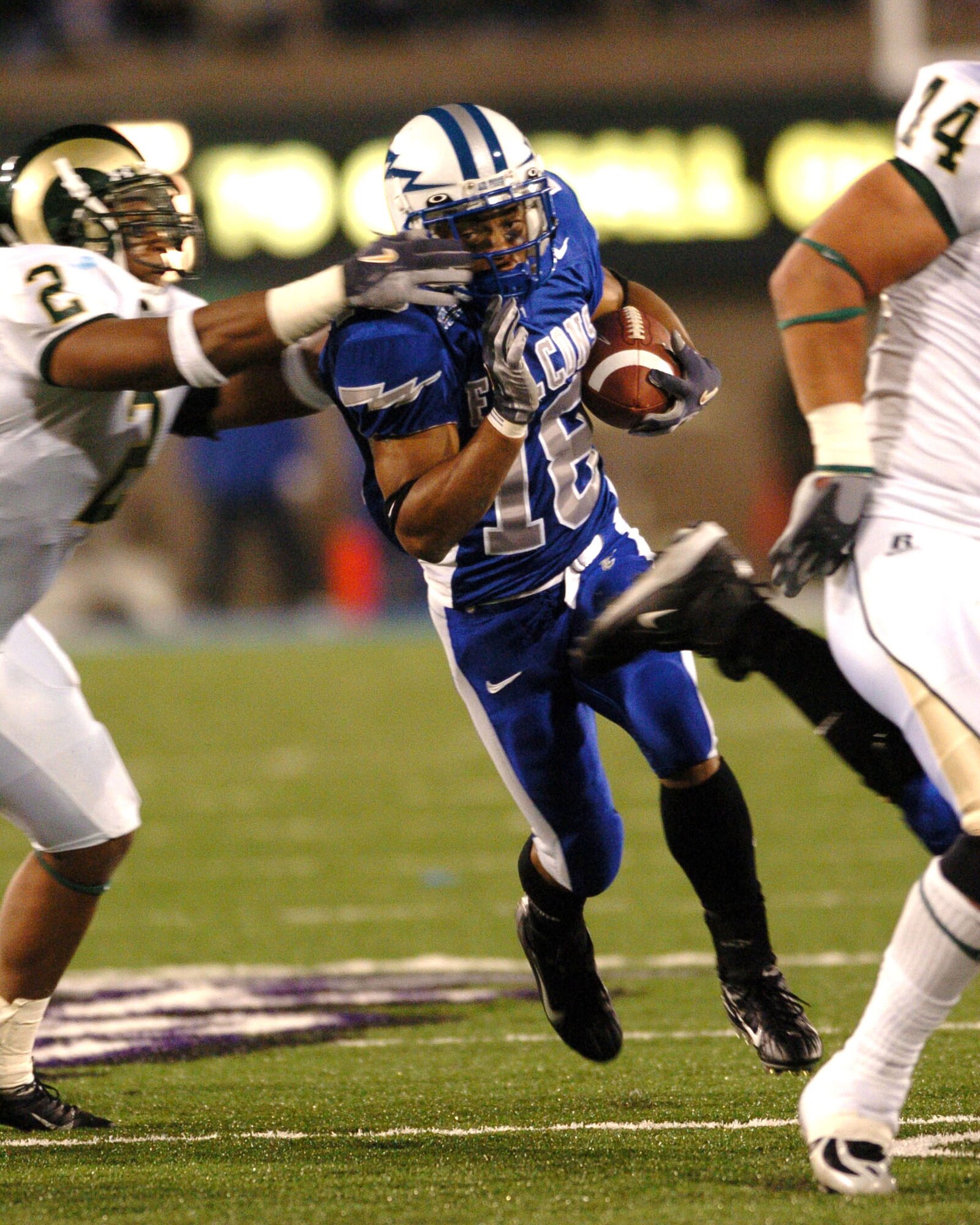 Air Force halfback Justin Handley turns the corner on Colorado State linebacker Jon Radford for a pickup of 12 and a Falcon first down Thursday night. The run helped set up a Zach Sasser field goal, providing the winning margin as Air Force defeated CSU, 24-21. (U.S. Air Force photo/1st Lt. John Ross)

