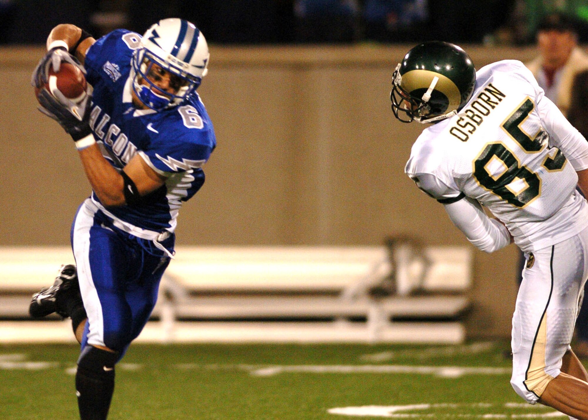 Air Force cornerback Chris Sutton intercepts a late-game pass from Colorado State quarterback Caleb Hanie Thursday night to end CSU's hopes of winning the game. After trailing at halftime 21-3, Air Force scored 21 unanswered points in the second half to win, 24-21. (U.S. Air Force photo/1st Lt. John Ross)
