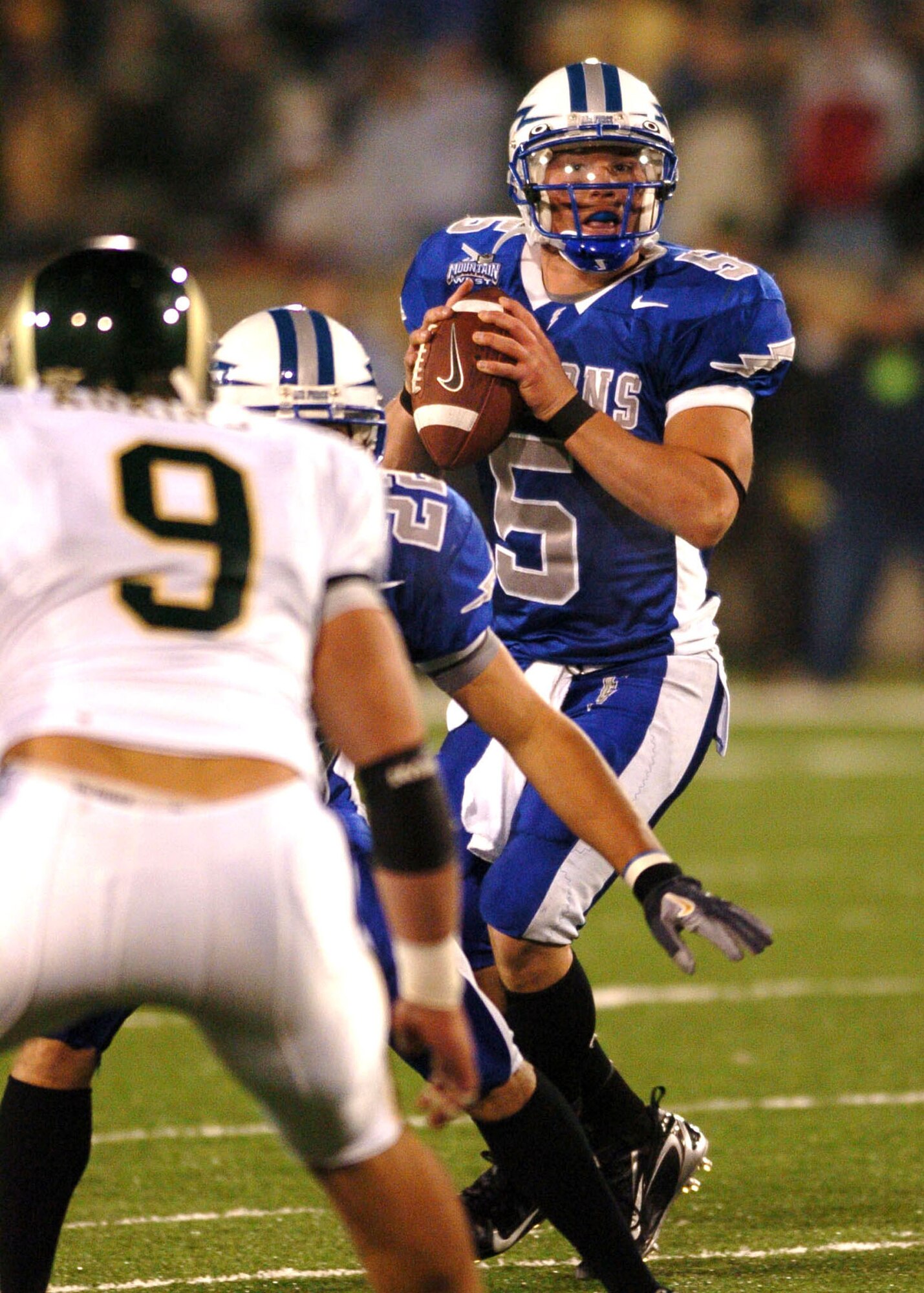 Air Force quarterback Shaun Carney surveys the field before finding wide receiver Victor Thompson in the end zone for the game-winning touchdown Thursday night, to cap a come-from-behind victory over cross-state rival Colorado State. Air Force won, 24-21. (U.S. Air Force photo/1st Lt. John Ross)
