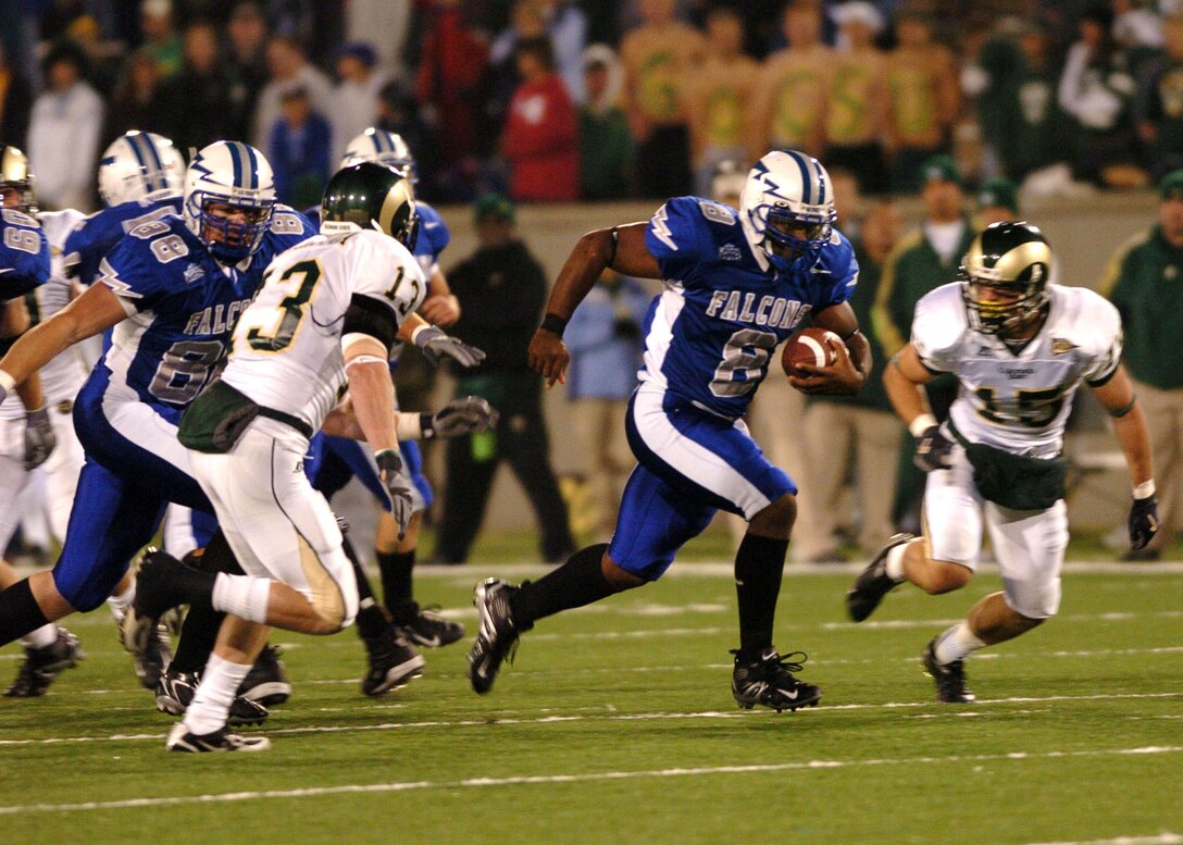 Air Force fullback Jacobe Kendrick meets Colorado State defensive back Mike Pagnotta after a 15 yard pickup and a Falcon first down Thursday night.  After trailing at halftime 21-3, Air Force scored 21 unanswered points in the second half to win, 24-21. (U.S. Air Force photo/1st Lt. John Ross)

