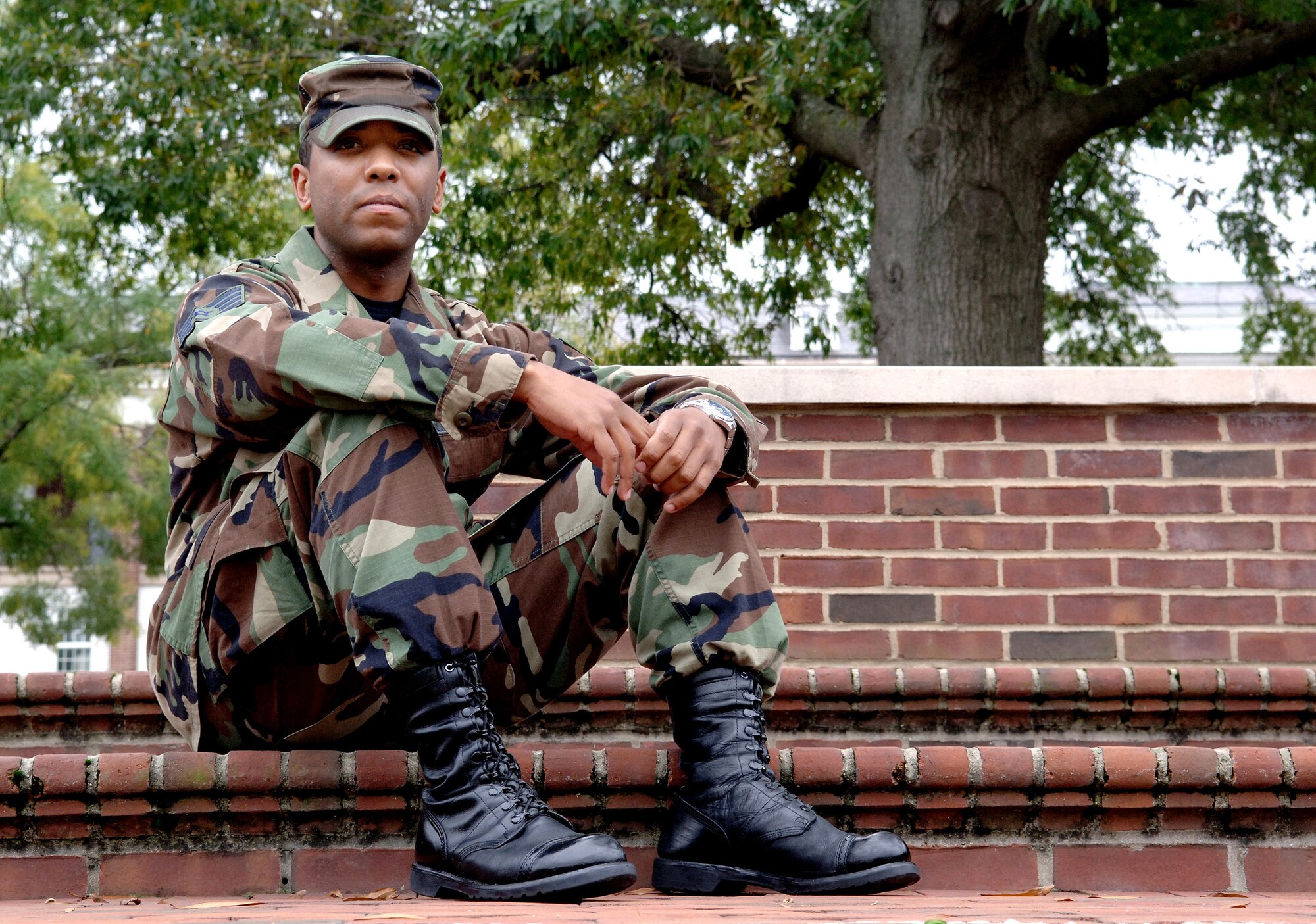 Staff Sgt. Paul Piper sits on some steps outside the wing headquaters builiding Oct. 11 at Bolling Air Force Base, Washington, D.C. Sergeant Piper is a command post controller with the Air Force District of Washington and is involved with the Air Force Memorial dedication ceremony Oct. 14 in Arlington, Va. (U.S. Air Force photo/Tech. Sgt. Larry A. Simmons)