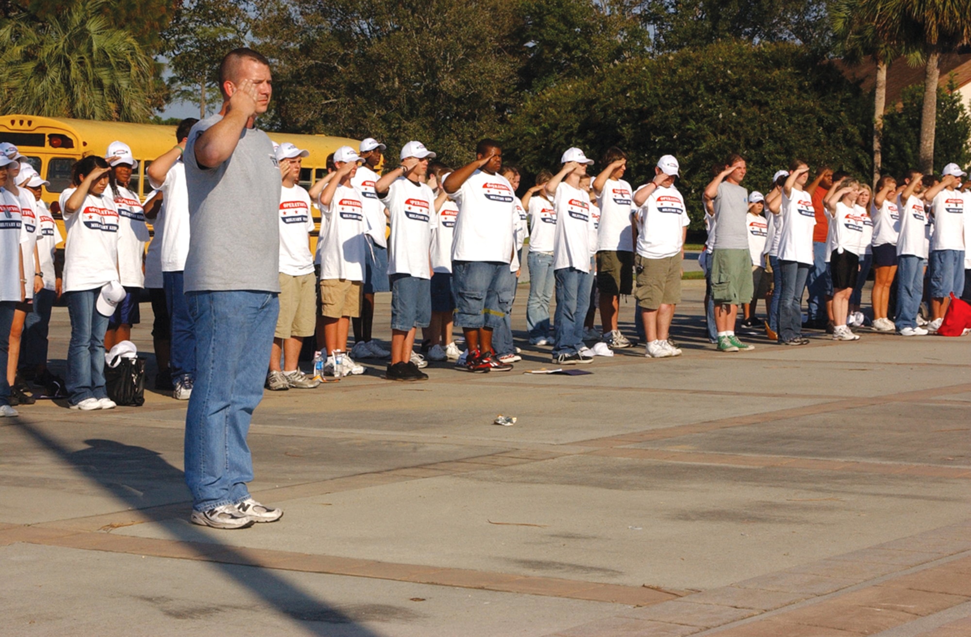 TYNDALL AIR FORCE BASE, Fla. (AETCNS) -- Tech. Sgt. Tim Barnett, Tyndall AFB NCO Academy, has the 4-H Club teens present arms during a base Sept. 11, 2001, remembrance and flag folding ceremony at Flag Park here Sept. 10. (U.S. Air Force photo by Staff Sgt. Benjamin Rojek)