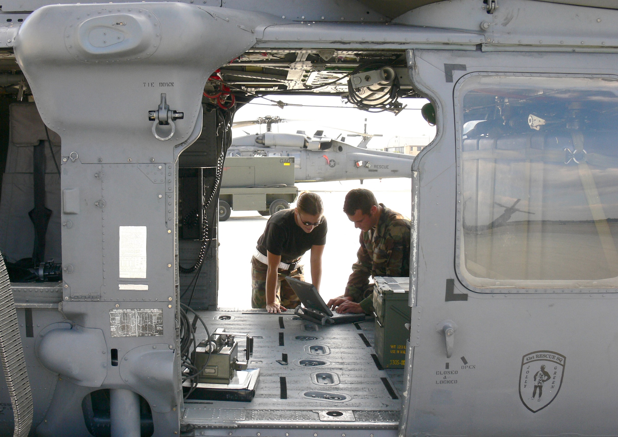 Staff Sgt. Janell McGivern and Airman 1st Class Steven Symsick order parts via computer from within an HH-60G Pave Hawk helicopter Oct. 10 at Moody Air Force Base, Ga. These new procedures are designed to save Air Force resources and were the focus a recent five-day Rapid Improvement Event. The event featured a delegation of Air Combat Command facilitators who assisted maintenance leaders in applying Air Force Smart Operations 21 initiatives. Sergeant McGivern and Airman Symsick are assigned to the 723rd Aircraft Maintenance Squadron at Moody AFB. (U.S. Air Force photo/Airman 1st Class Eric Schloeffel)