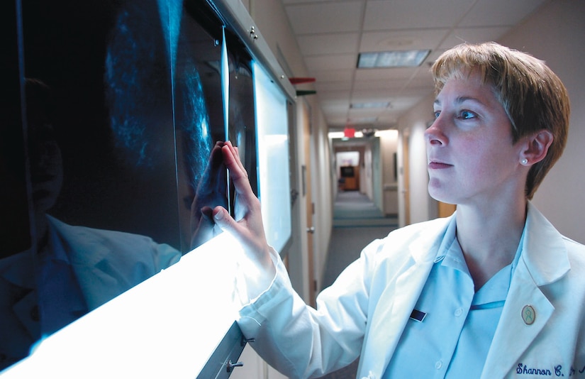 Maj. (Dr.) Shannon Lehr screens a set of mammogram X-rays in conjunction with a patient's office visit. Major Lehr is one of four general surgeons assigned to the 79th Surgical Operations Squadron at Malcolm Grow Medical Center. The American Cancer Society, a nationwide health organization, encourages women ages 20 and older to conduct breast self-examinations monthly. Breast examinations and screenings by a doctor are also recommended annually.