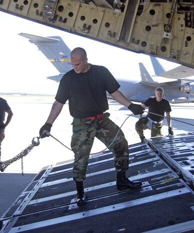 Staff Sgt. Frank Douglass, 437th Aerial Port Squadron transportation specialist, keeps the winch line slack during Aerial Port Expeditor training on the flightline Oct. 3. (U.S. Air Force photo/Airman 1st Class Sam Hymas)
