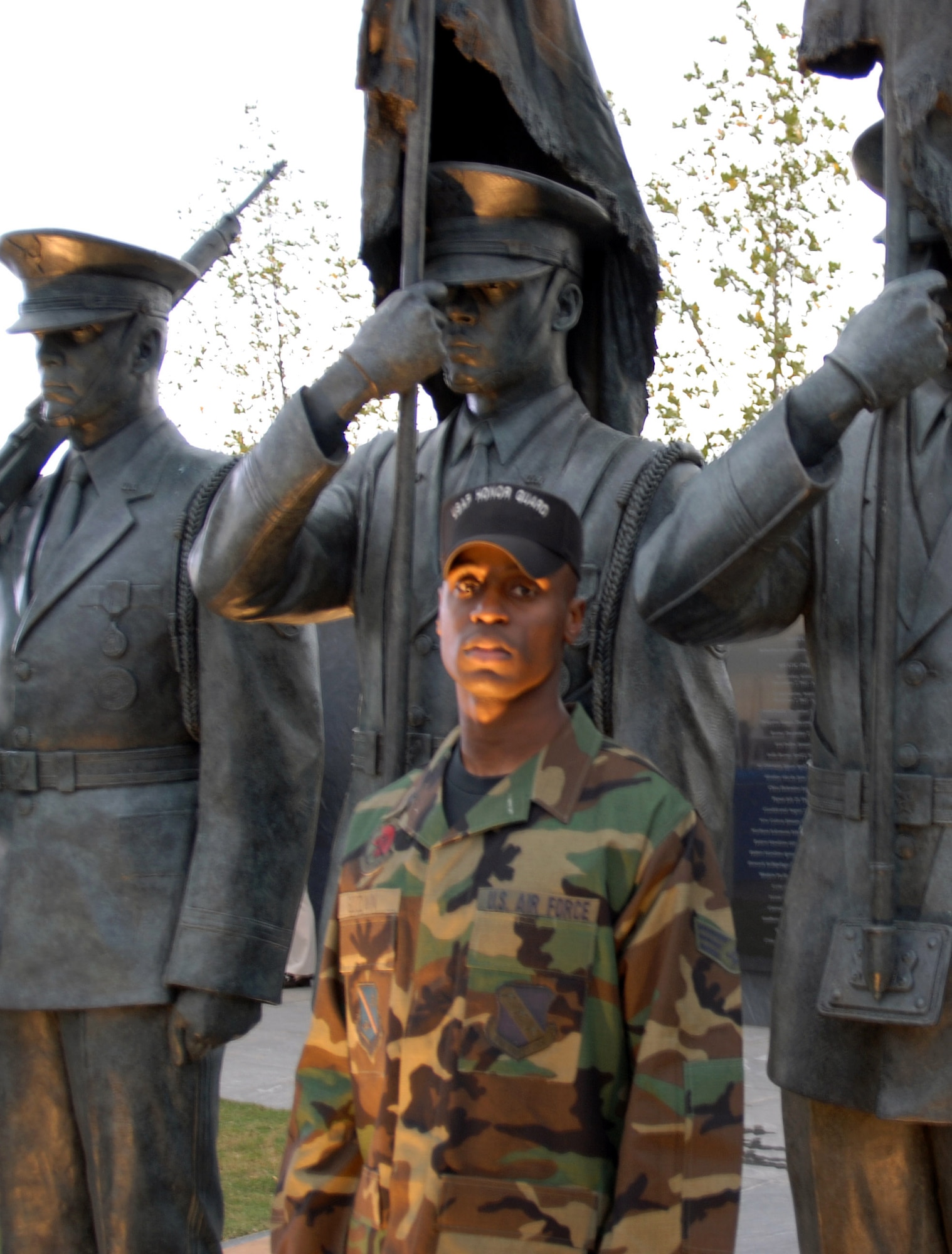 Senior Airman Michael Goodwin stands in front of the Air Force Honor Guard statue he was used as a model for, which now resides at the Air Force Memorial.  (U.S. Air Force photo/Senior Airman David Merrick)