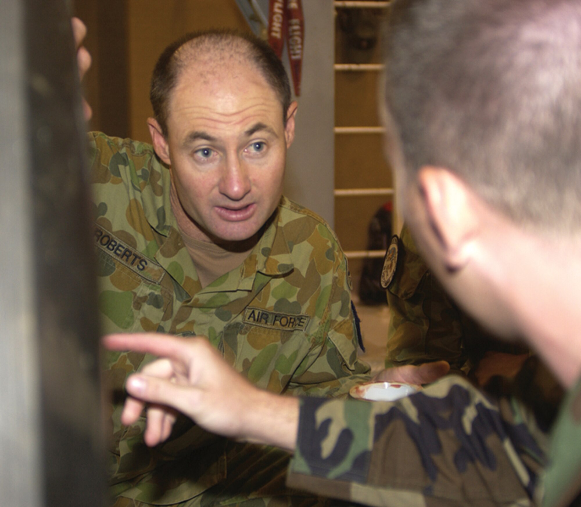 Royal Australian Air Force Cpl. David Roberts receives training on replacing the nose landing gear of a C-17 by Tech. Sgt. Troy Barber, 373rd Training Squadron Detachment 5, at the 373 Det. 5 training building Sept. 29. Twenty-four RAAF members have been here since July 31 receiving training on C-17 maintenance procedures. (U.S. Air Force photo/Airman 1st Class Sam Hymas)