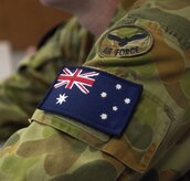 The Australian flag and air force patch on an Royal Australian Air Force member's uniform. Twenty-four RAAF members have been at Charleston AFB since July 31 receiving training on C-17 maintenance procedures.  (U.S. Air Force photo/Airman 1st Class Sam Hymas)