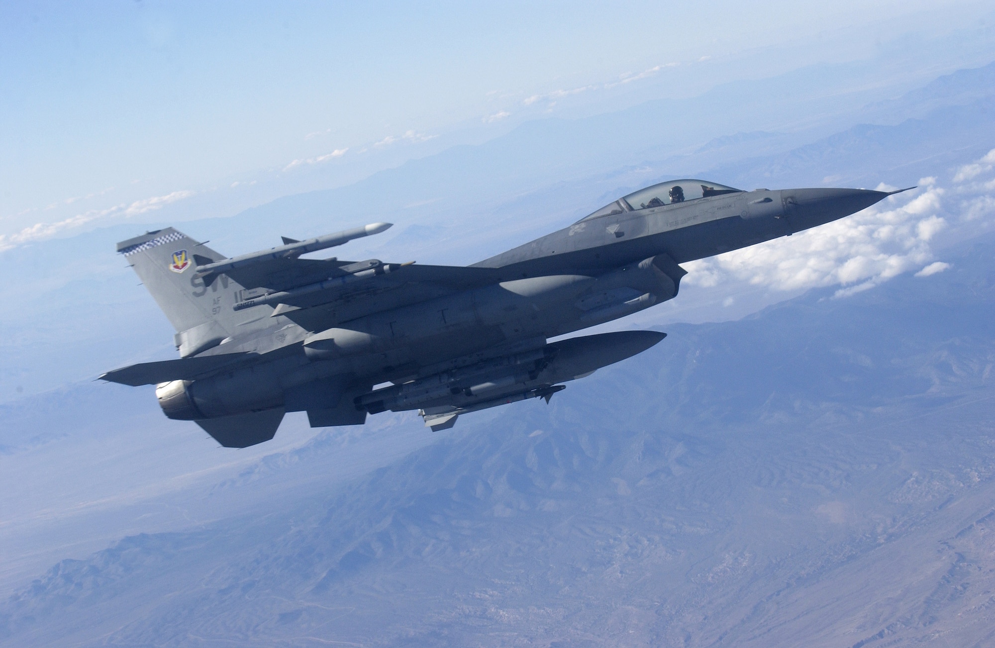 An F-16 Fighting Falcon flies over Nevada Oct. 11 during Red Flag 07-1 being held at Nellis Air Force Base, Nev. Red Flag runs Oct. 10 to 20 and tests aircrews' warfighting skills in realistic combat situations. The aircraft will be flying missions during the day and night at the nearby Nevada Test and Training Range where they will simulate an air war. U.S. servicemembers, with representatives from each branch of service along with coalition forces, are participating in Red Flag.  (U.S. Air Force photo/Master Sgt. Kevin J. Gruenwald)