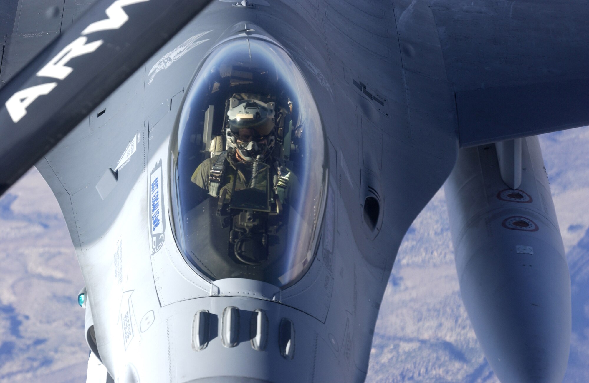 An F-16 Fighting Falcon approaches the boom on a KC-135 Stratotanker to refuel Oct. 11 during Red Flag 07-1 being held at Nellis Air Force Base, Nev. Red Flag runs from Oct. 10 to 20 and tests aircrews' warfighting skills in realistic combat situations. The aircraft will be flying missions during the day and night at the nearby Nevada Test and Training Range where they will simulate an air war. U.S. servicemembers, with representatives from each branch of service along with coalition forces, are participating in Red Flag.  (U.S. Air Force photo/Master Sgt. Kevin J. Gruenwald)