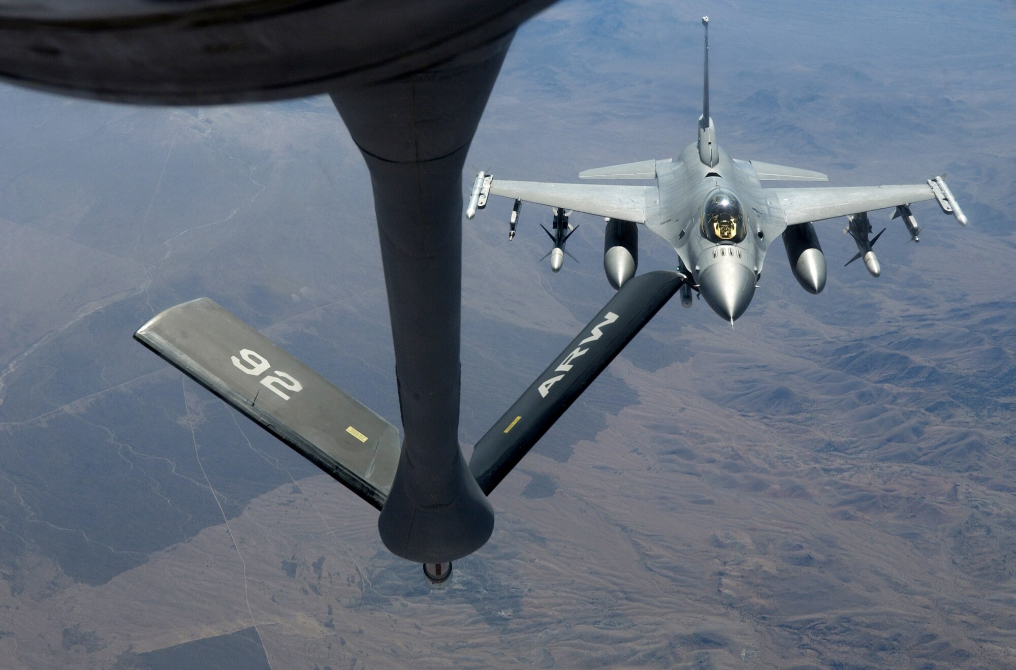 An F-16 Fighting Falcon approaches the boom on a KC-135 Stratotanker to refuel Oct. 11 during Red Flag 07-1 being held at Nellis AFB, Nev. Red Flag runs from Oct. 10 to 20 and tests aircrews' warfighting skills in realistic combat situations. The aircraft will be flying missions during the day and night at the nearby Nevada Test and Training Range where they will simulate an air war. U.S. servicemembers, with representatives from each branch of service along with coalition forces, are participating in Red Flag. (U.S. Air Force photo/Master Sgt. Kevin J. Gruenwald)


