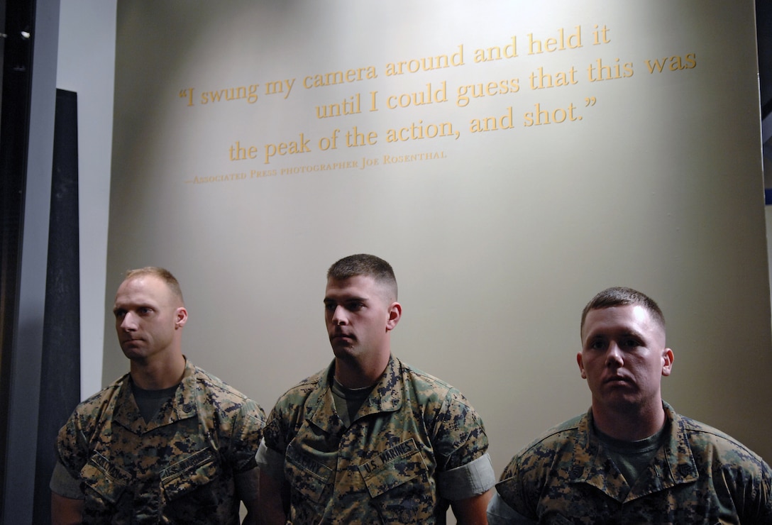 U.S. Marines stand at parade rest under the words of  Joe Rosenthal who photographed the now famous shot of  U.S. Marines raising the flag on Mount Suribachi, Iwo Jima. The National Museum of the Marine Corps Quantico, Va., will open Nov. 10, 2006. 