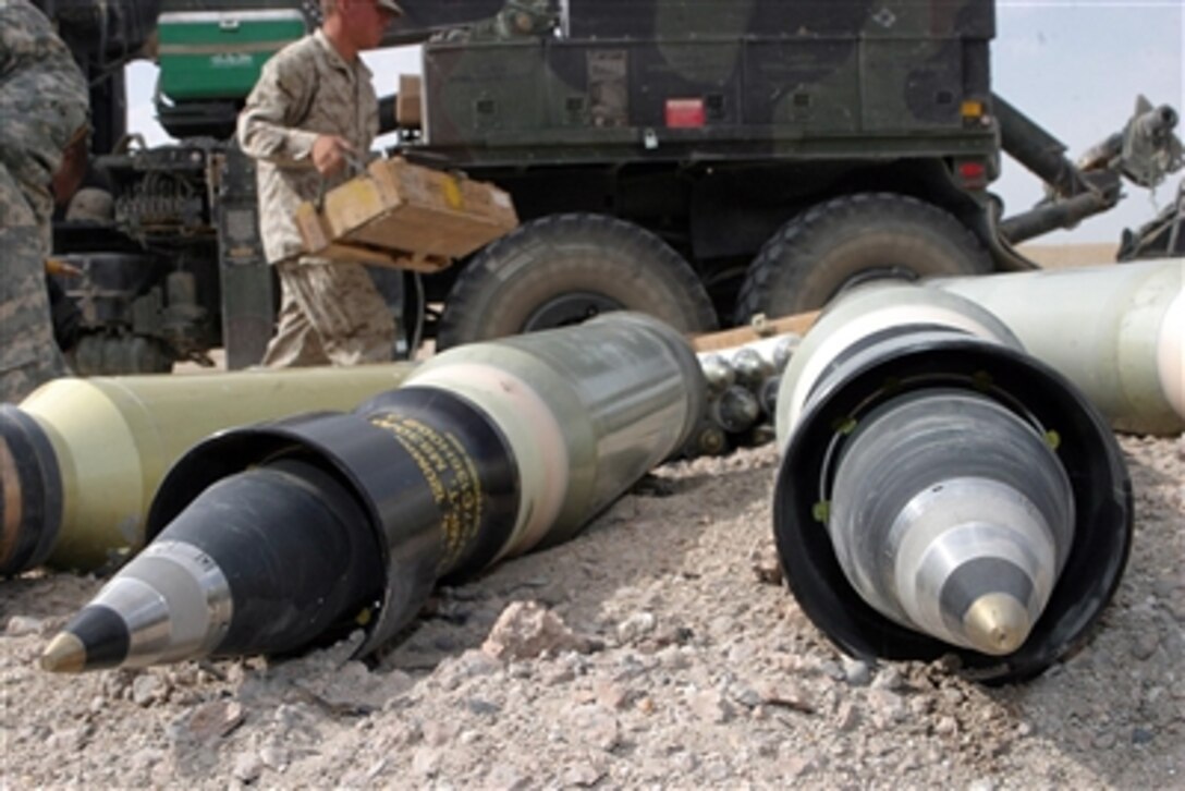 U.S. Marines from the ammunition detachment, Combat Logistics Regiment 15, 1st Marine Logistics Group, and an Army soldier prepare ordnance for detonation during emergency destruction training at Camp Taqaddum, Iraq, Oct. 4, 2006. 