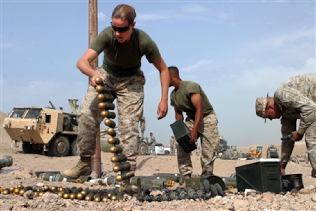 U.S. Marines from the ammunition detachment, Combat Logistics Regiment 15, 1st Marine Logistics Group, prepare ordnance for detonation during emergency destruction training at Camp Taqaddum, Iraq, Oct. 4, 2006. 