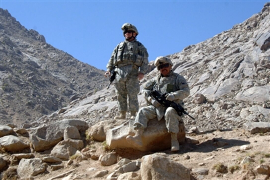 U.S. Army soldiers with 102nd Infantry Regiment, Connecticut National Guard provide security during a medical and veterinarian civic action program in Charkh, Afghanistan, Oct. 6, 2006. 