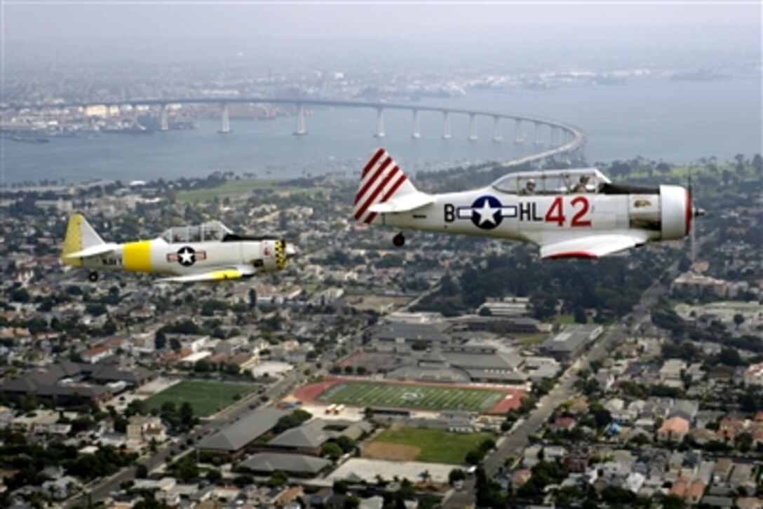 Two T-6 Texan aircraft fly over Naval Base Coronado, Calif., Oct. 8, 2006, as part of the Coronado Classic Speed Festival opening ceremonies. 