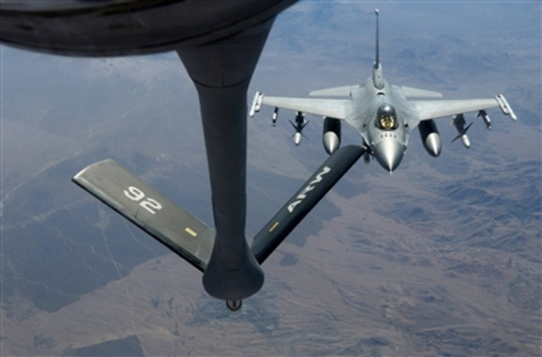 An F-16 Fighting Falcon aircraft approaches the refueling boom on a KC-135 "Stratotanker" aircraft during exercise Red Flag 07-1 at Nellis Air Force Base, Nev., on Oct. 11, 2006.  The exercise tests aircrews' war fighting skills in realistic combat situations.  U.S. service members with representatives from each branch of service and coalition forces are participating in Red Flag.  